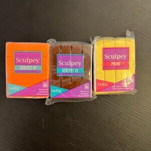 A set of three warm-toned Sculpey oven baking clays